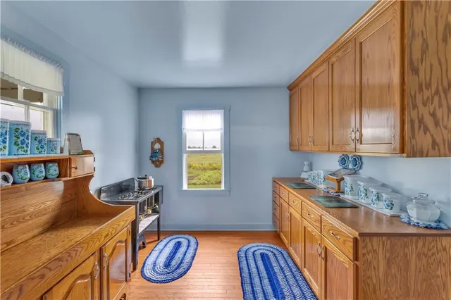 a kitchen that has a sink and a stove