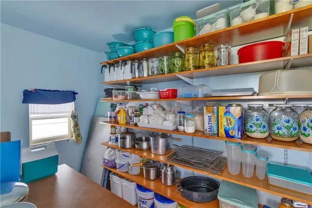 a room with lots of furniture and wooden floor