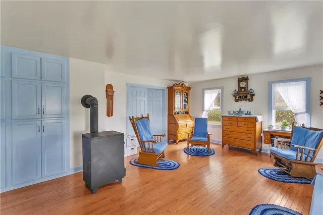 a dining room with furniture and wooden floor