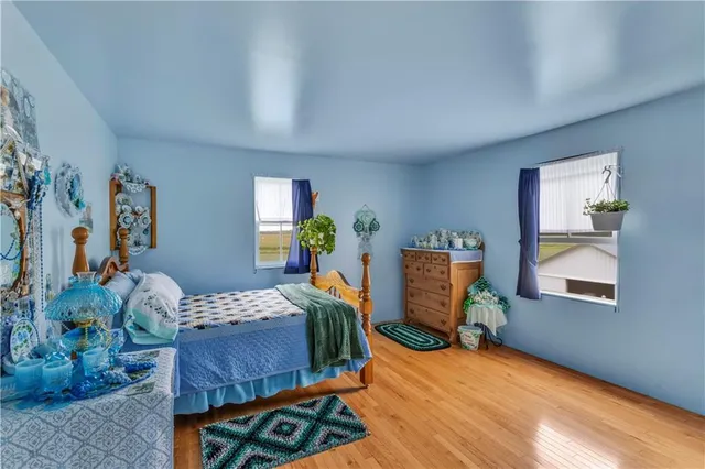 a bedroom with furniture and a window