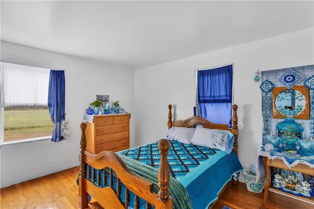 a bedroom with furniture and a window