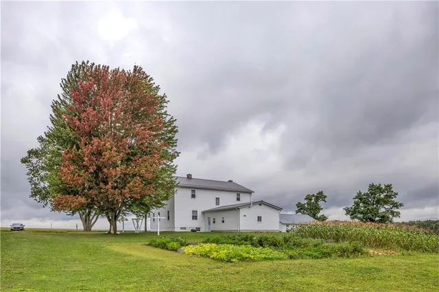 a house with garden in front of it