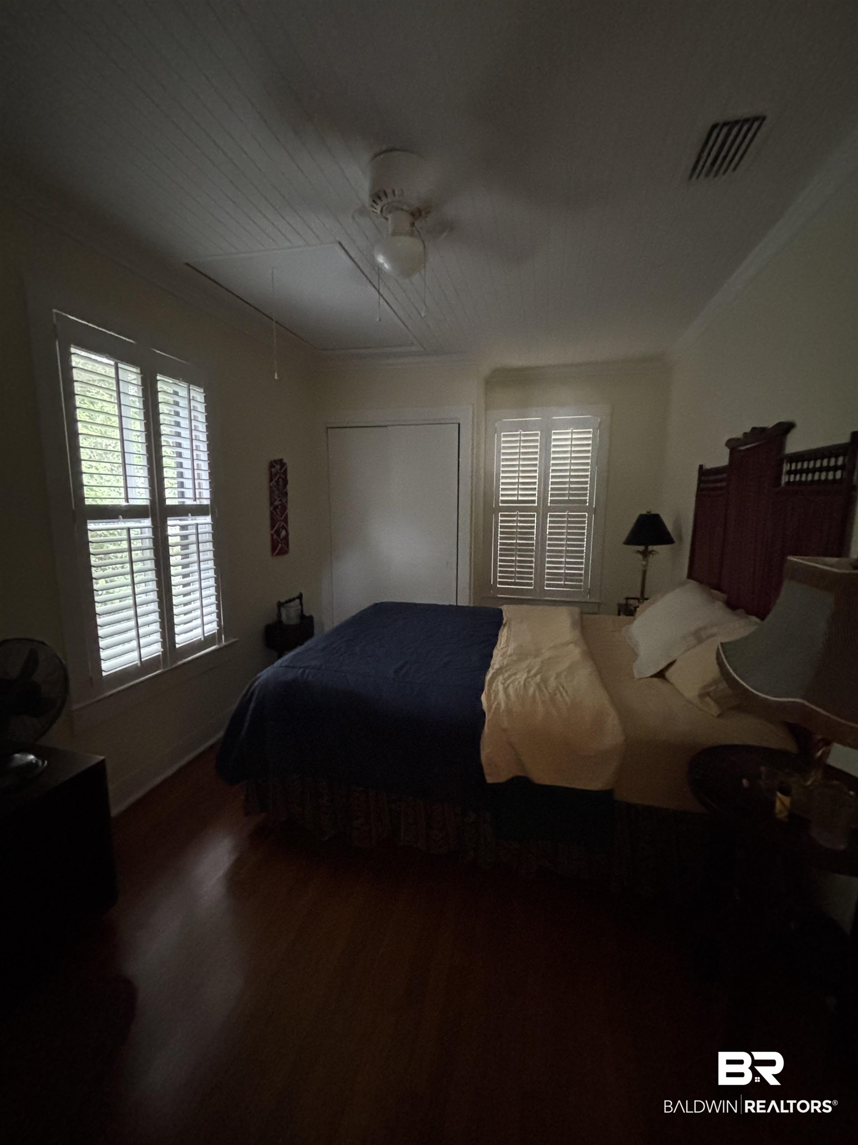 216 West Orange Avenue Foley, AL 36535 - Photo 14 of 37 Bedroom featuring wood finished floors, a ceiling fan, and ornamental molding