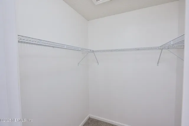 a view of a room with racks on the wall