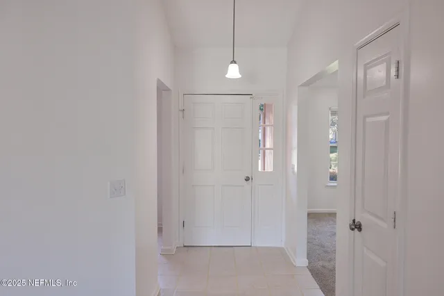 a bathroom with a shower and a glass door