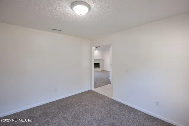 a view of a hallway with a room