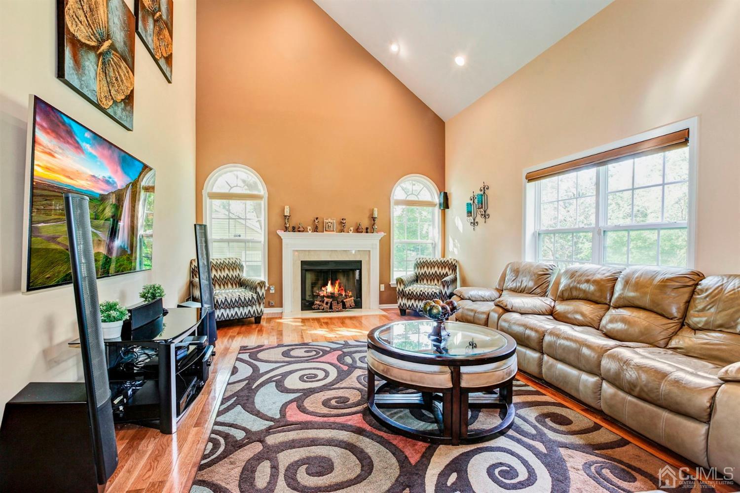30 Richard Road Edison, NJ 08820 - Photo 14 of 30 a living room with furniture a fireplace and a large window