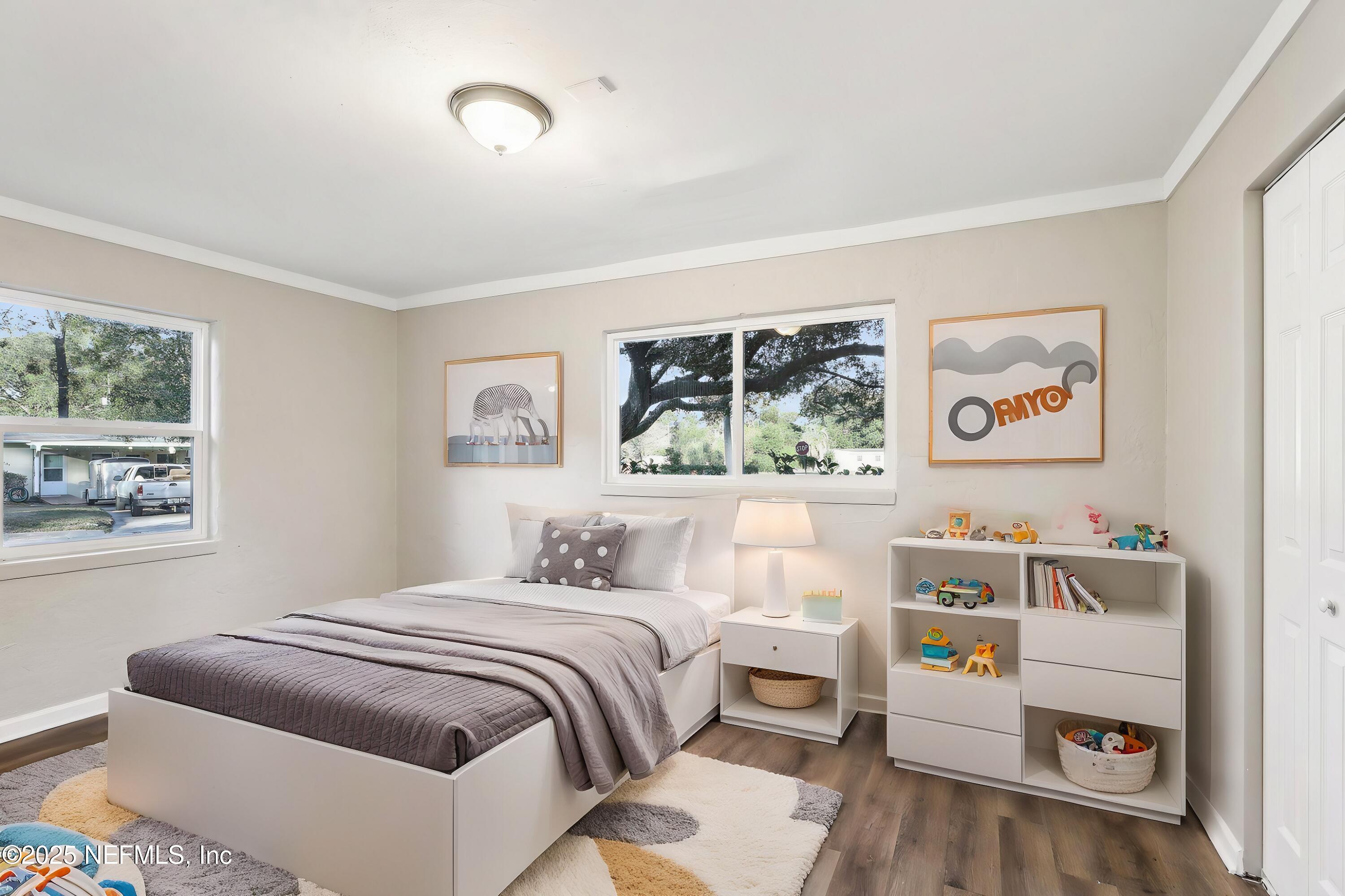 1268 King Arthur Road Jacksonville, FL 32211 - Photo 22 of 35 a bedroom with a bed and a window