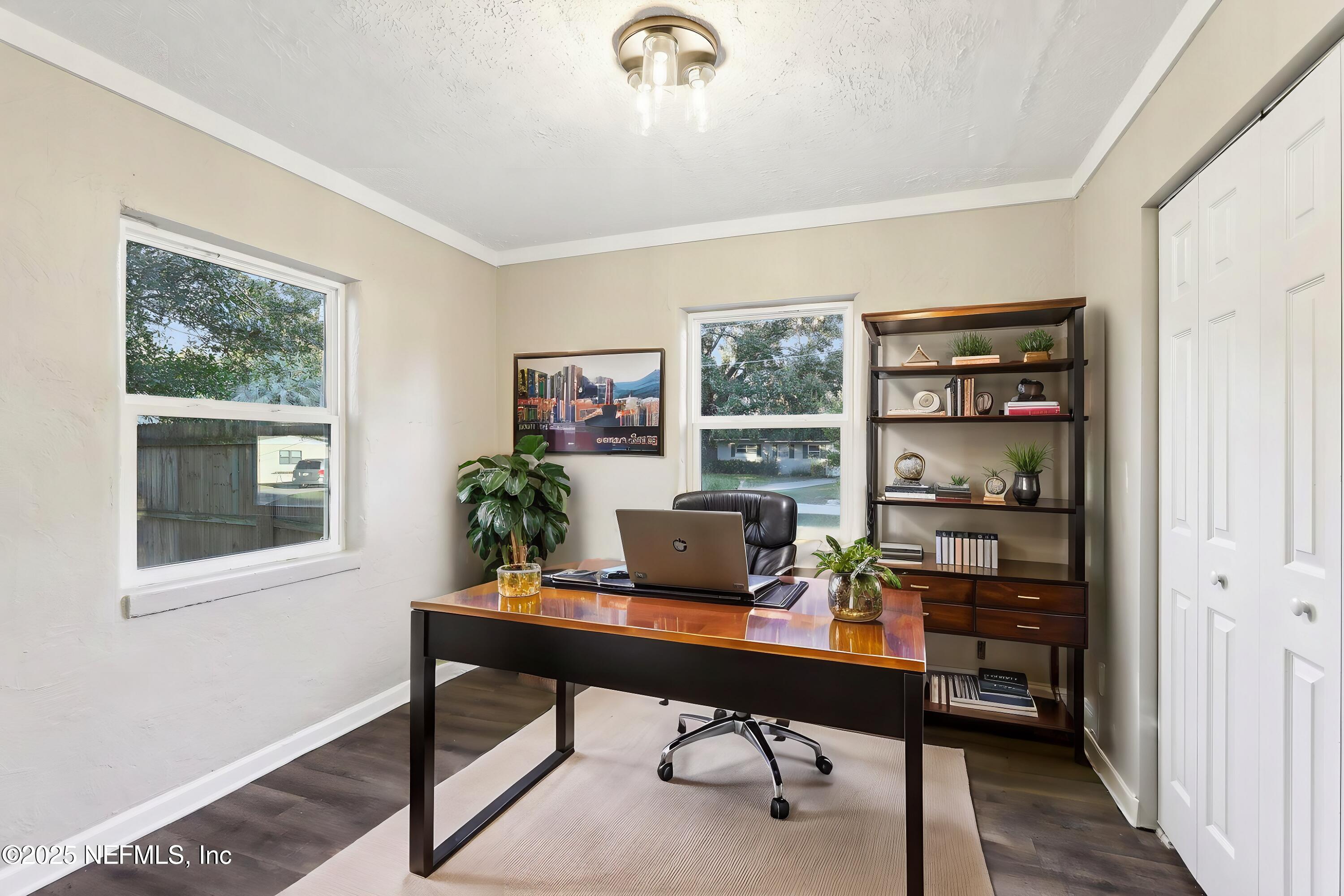 1268 King Arthur Road Jacksonville, FL 32211 - Photo 27 of 35 a view of a workspace with a window and wooden floor
