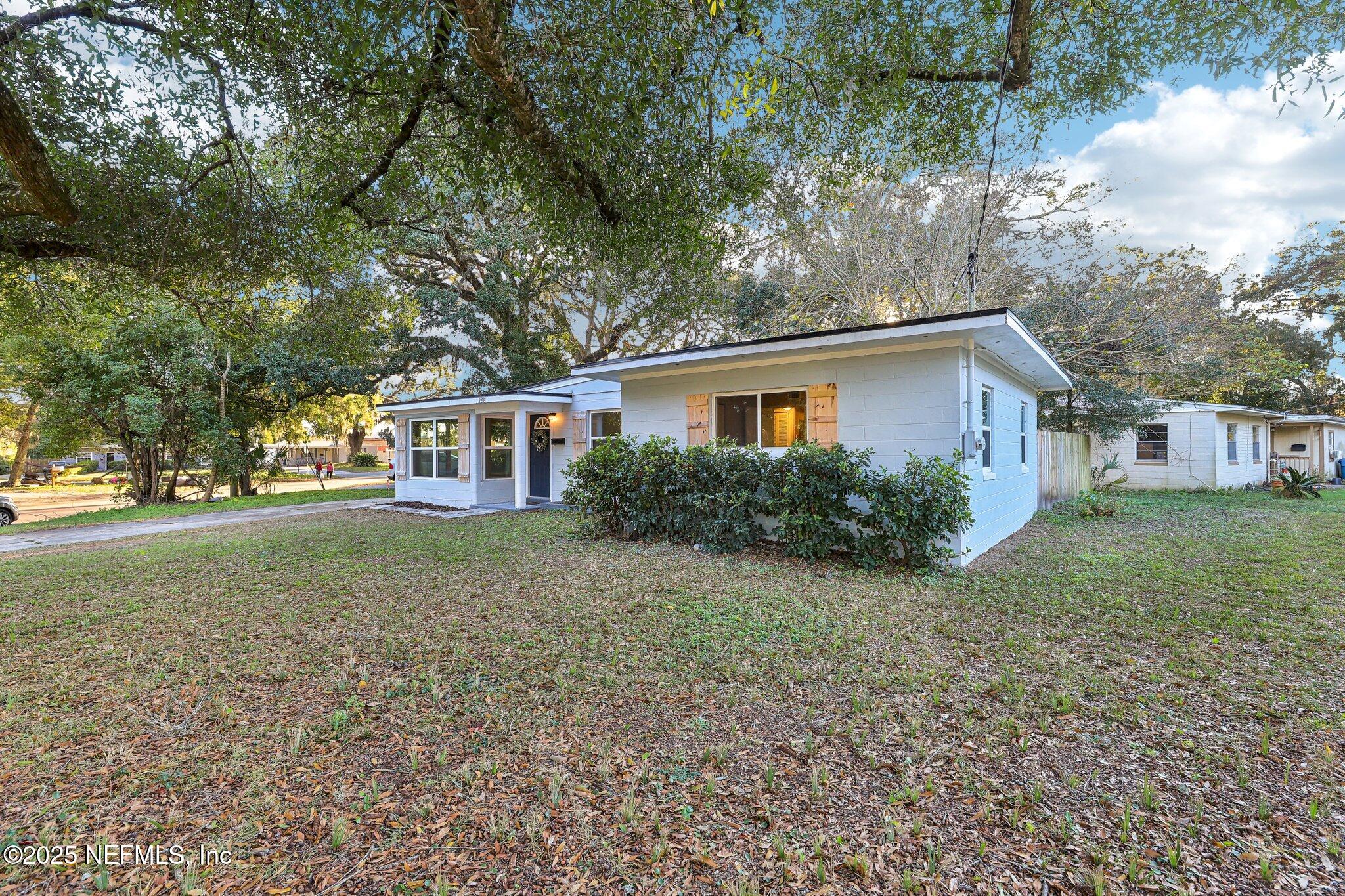 1268 King Arthur Road Jacksonville, FL 32211 - Photo 5 of 35 a view of a house with a yard