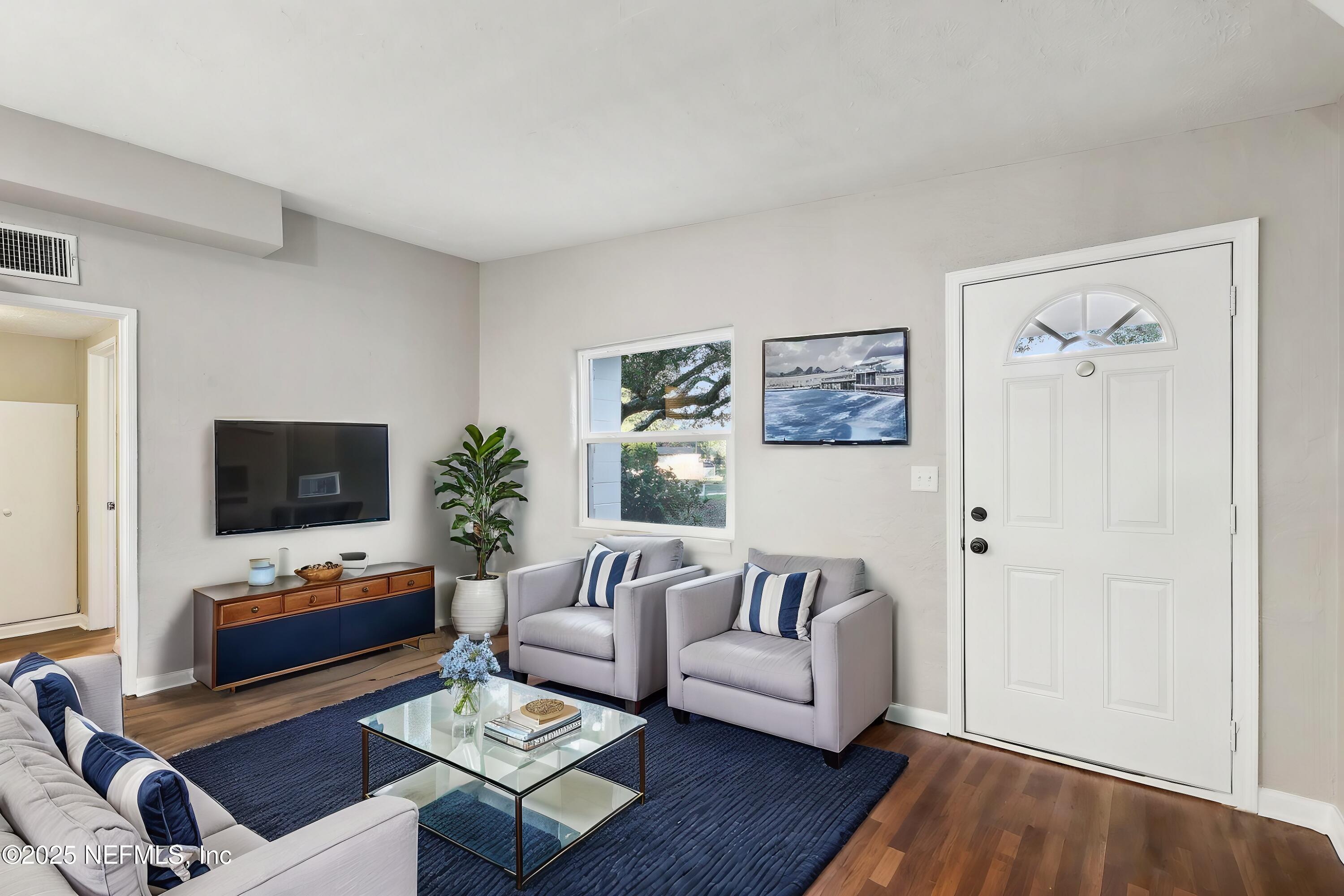 1268 King Arthur Road Jacksonville, FL 32211 - Photo 8 of 35 a living room with furniture and a flat screen tv