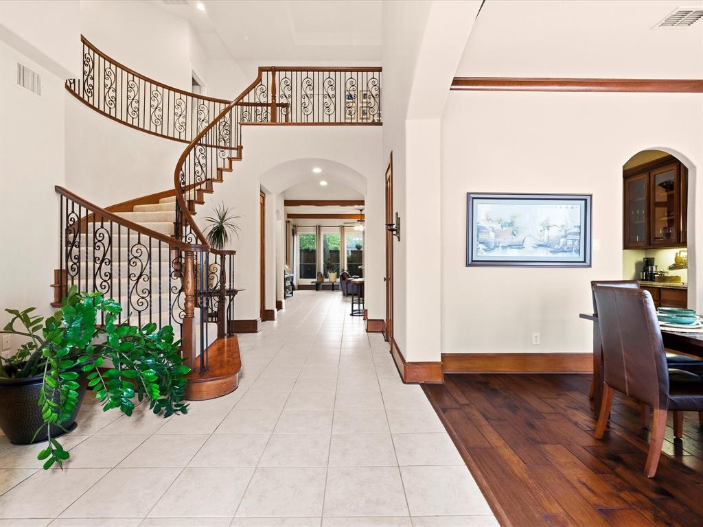 1615 Roma Lane Allen, TX 75013 - Photo 3 of 36 Beautiful curved staircase with ornate wrought iron balusters