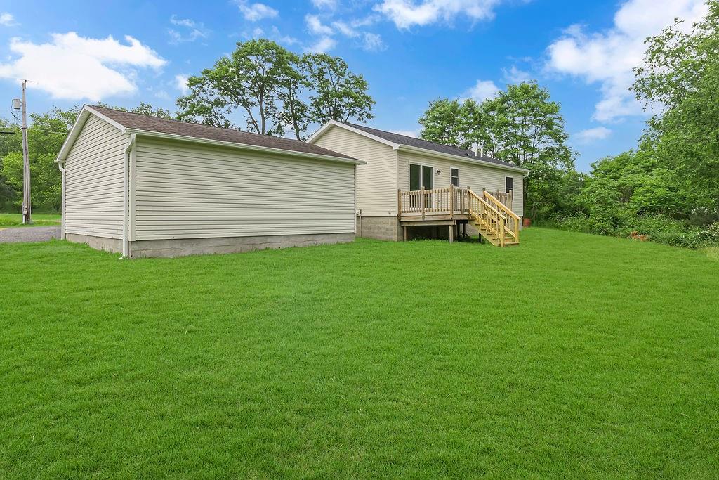 683 Mercer-New Wilmington Road Mercer, PA 16137 - Photo 7 of 22 a view of a house with a backyard