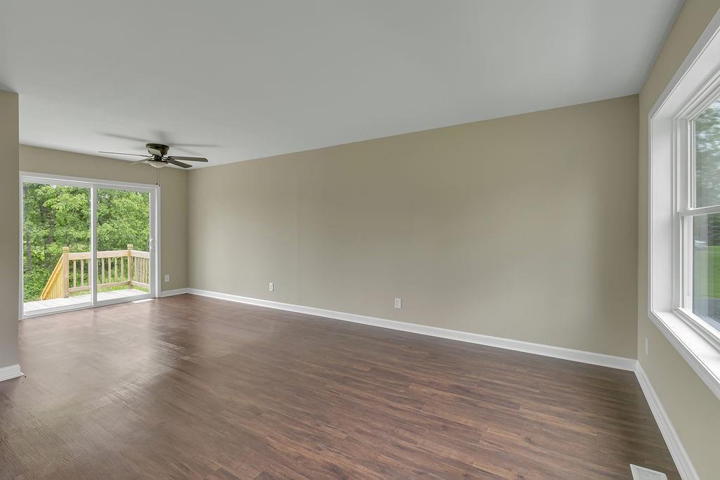 683 Mercer-New Wilmington Road Mercer, PA 16137 - Photo 9 of 22 wooden floor in an empty room with a window
