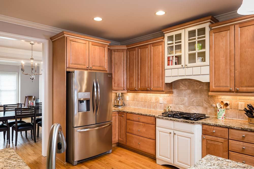 8415 Wheatstone Lane Raleigh, NC 27613 - Photo 10 of 30 Designed for your favorite foodie with gas cooktop and hood, and wall oven with microwave/convection oven (not pictured). Kitchen