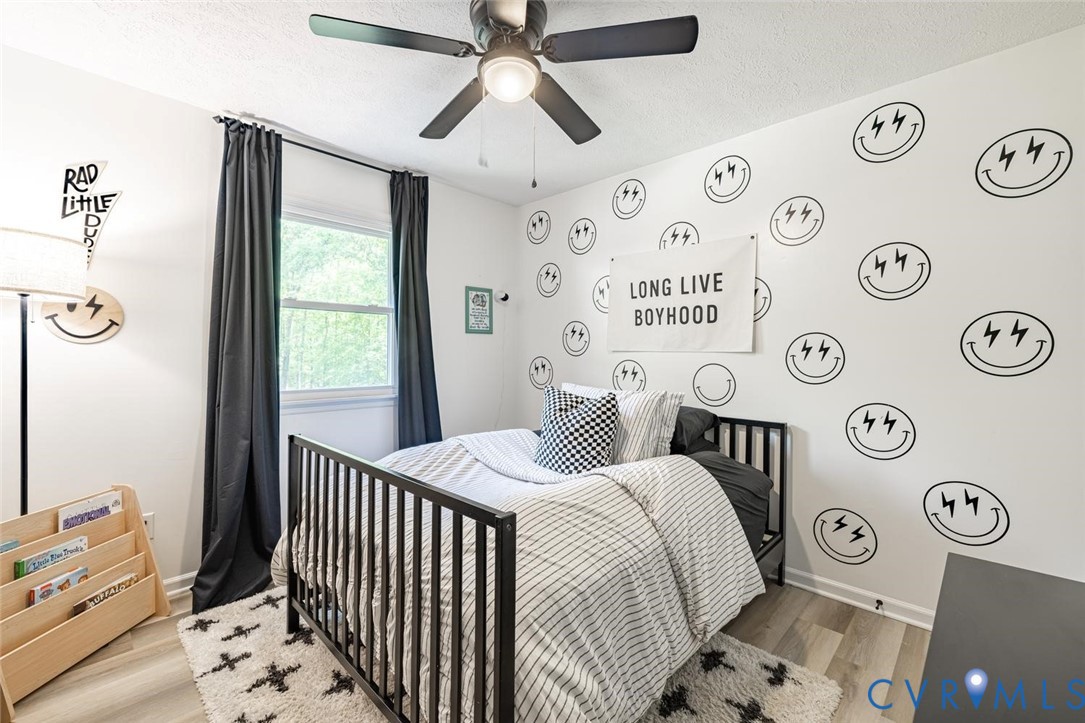 12397 New Market Mill Road Beaverdam, VA 23015 - Photo 20 of 44 a bedroom with a bed and a window