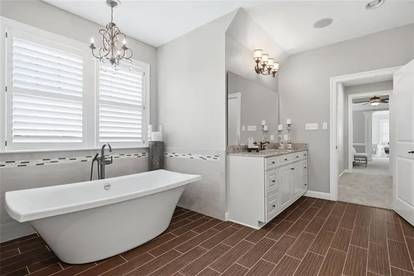 a bathroom with a glass shower door