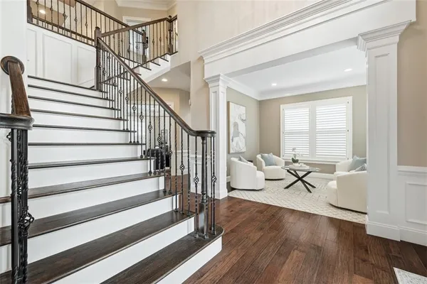 a living room with wooden floor and a window