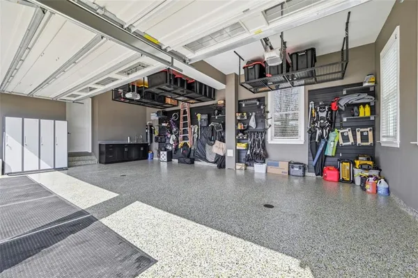 a kitchen with stainless steel appliances granite countertop a table chairs stove and kitchen view