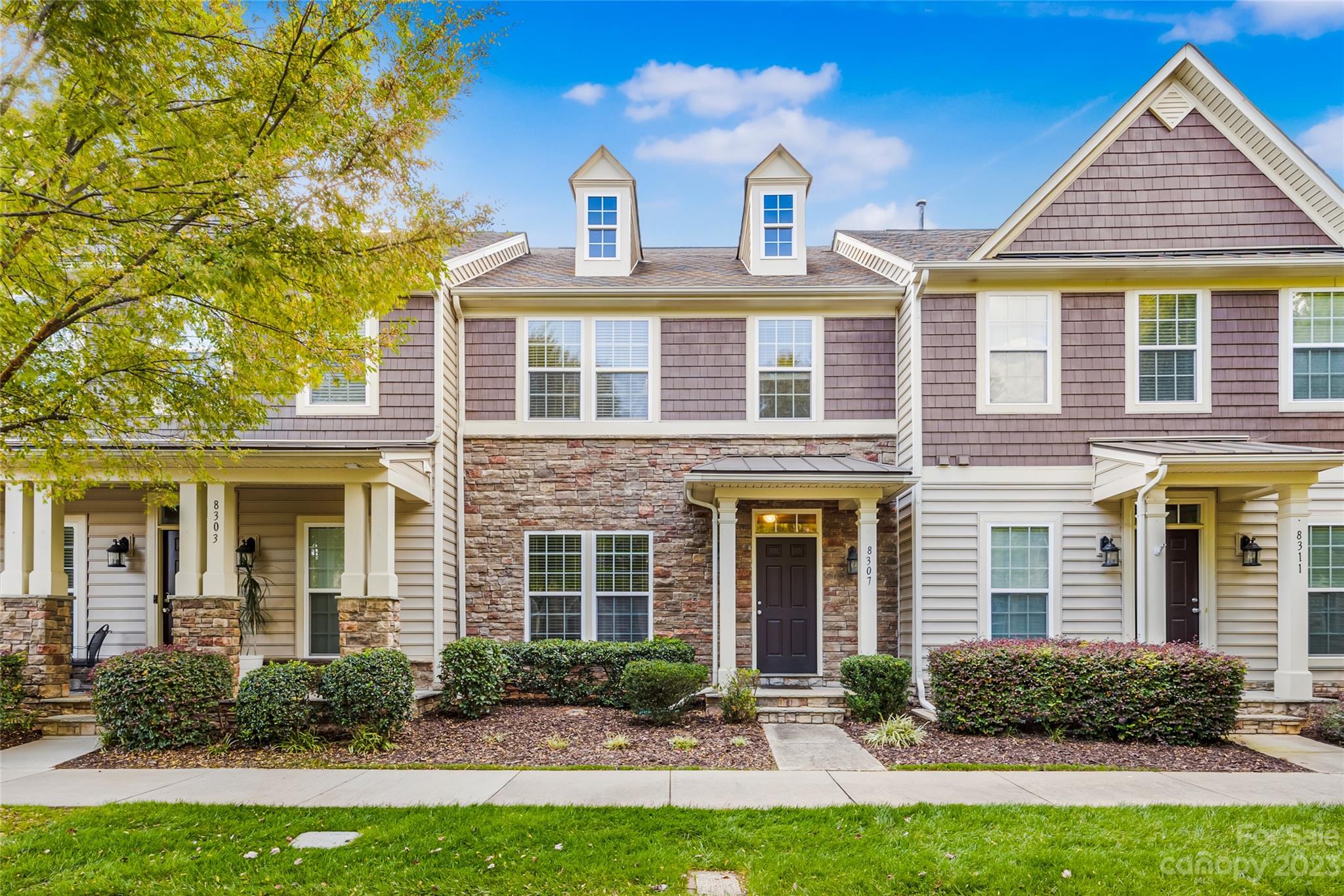 front view of a house with a yard