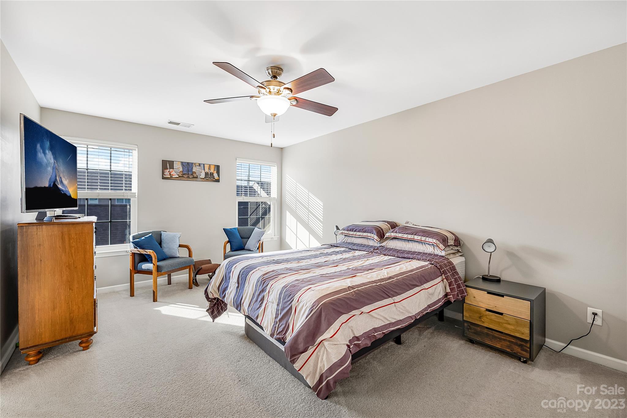 8307 Viewpoint Lane Cornelius, NC 28031 - Photo 11 of 25 a bedroom with a bed and a chandelier