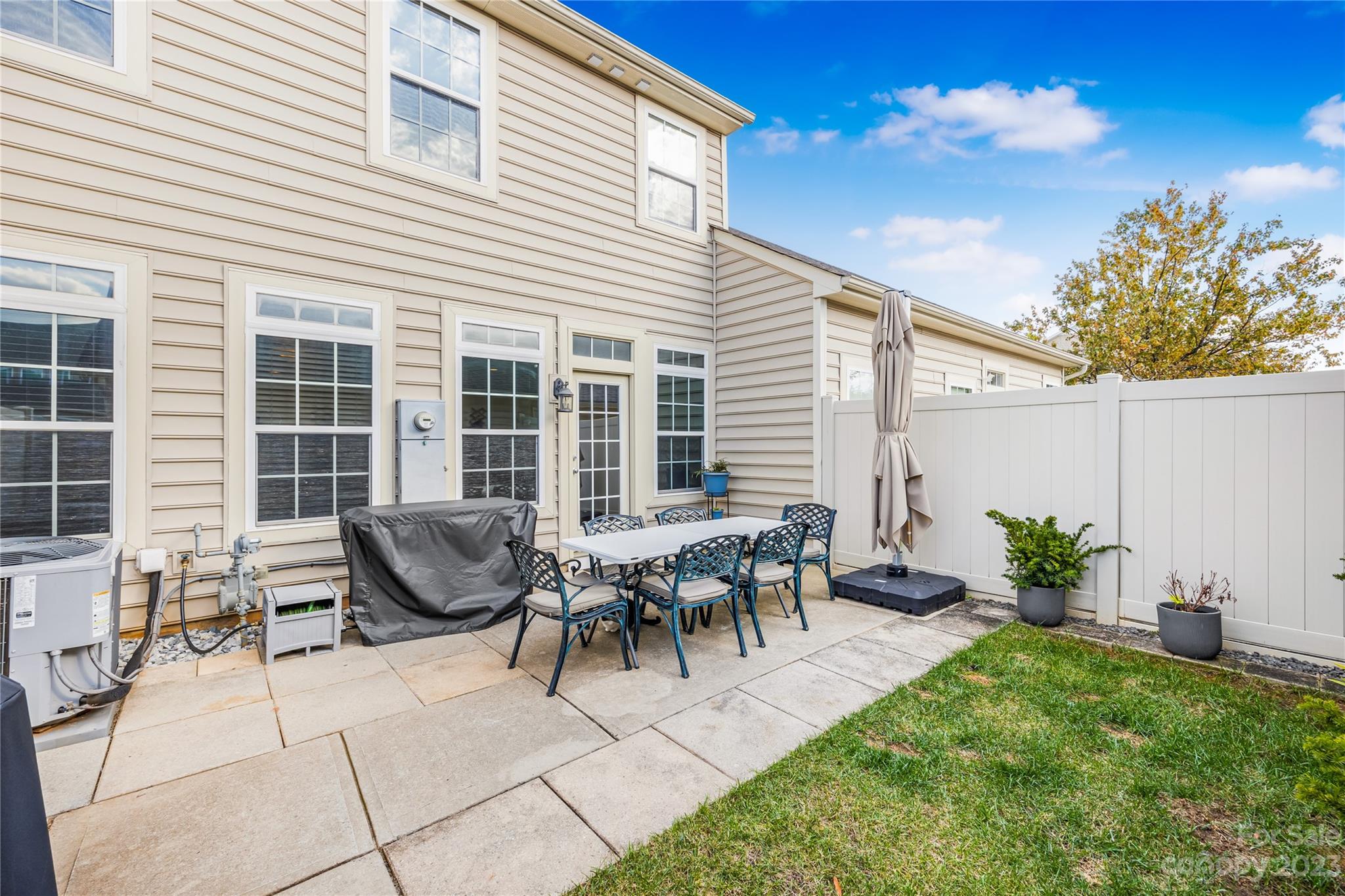 8307 Viewpoint Lane Cornelius, NC 28031 - Photo 18 of 25 a view of a house with patio and a yard