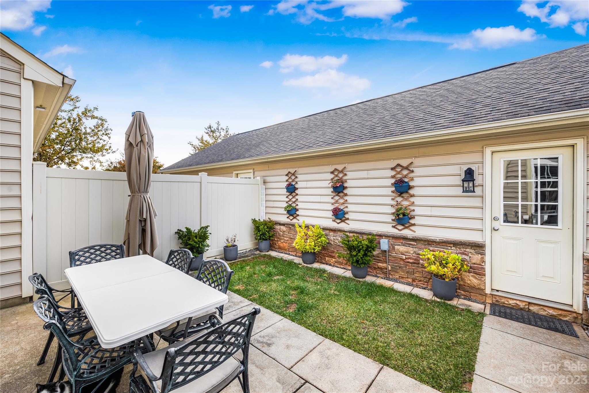 8307 Viewpoint Lane Cornelius, NC 28031 - Photo 19 of 25 a front view of a house with garden