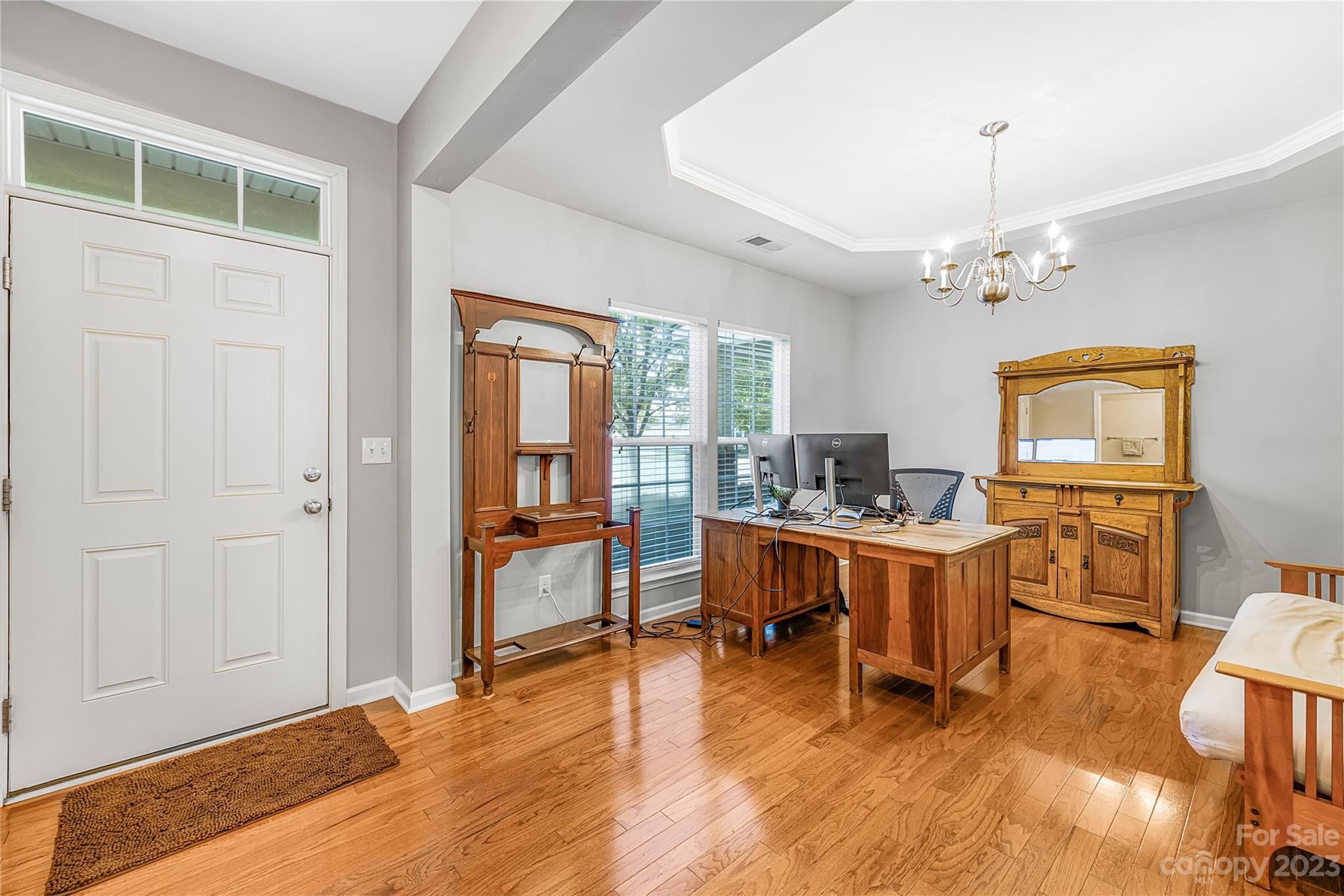 8307 Viewpoint Lane Cornelius, NC 28031 - Photo 2 of 25 a view of a dining room with furniture window and wooden floor