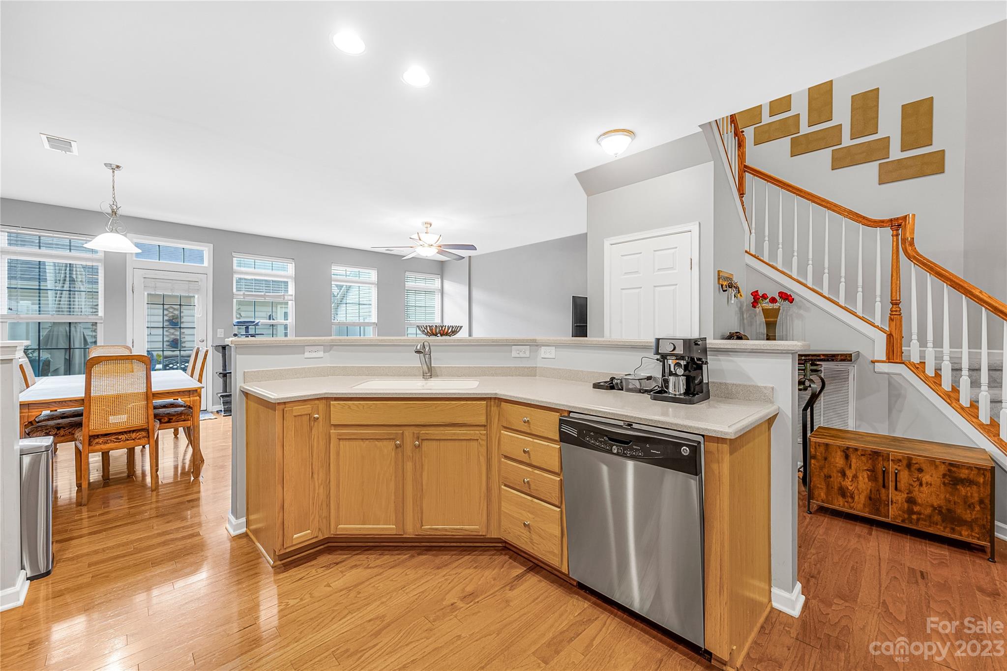 8307 Viewpoint Lane Cornelius, NC 28031 - Photo 5 of 25 a kitchen with stainless steel appliances granite countertop a sink and wooden cabinets