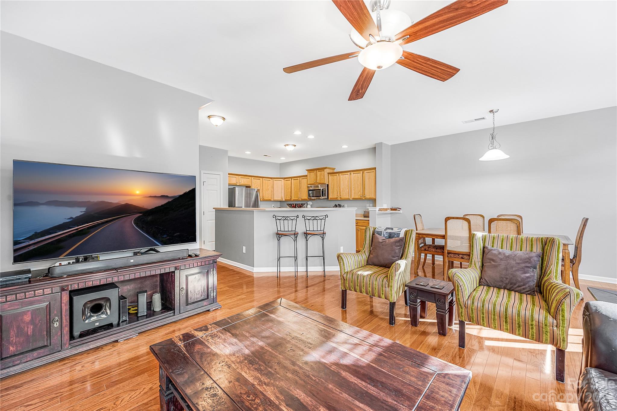 8307 Viewpoint Lane Cornelius, NC 28031 - Photo 8 of 25 a living room with furniture and a flat screen tv