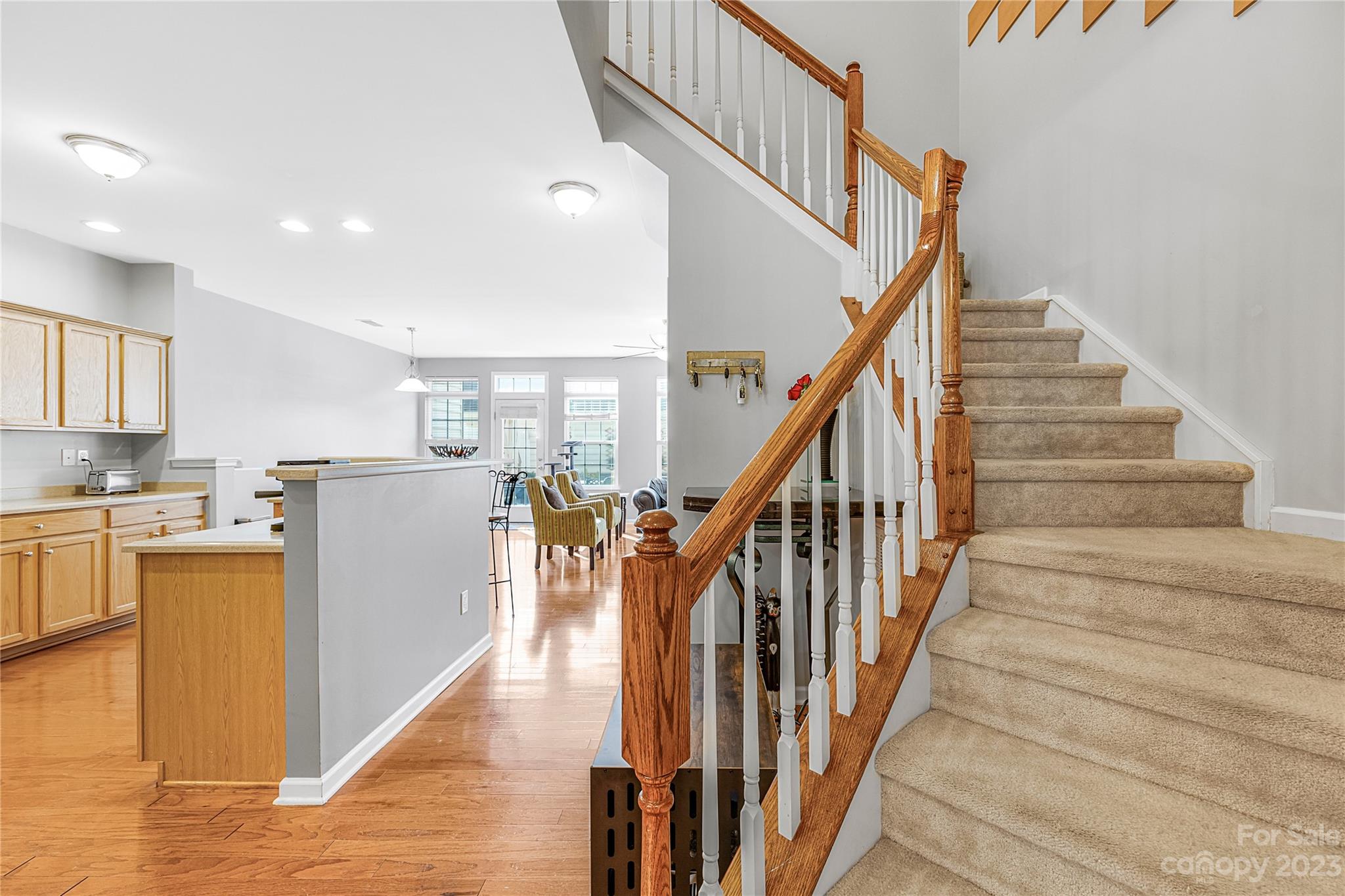 8307 Viewpoint Lane Cornelius, NC 28031 - Photo 10 of 25 a view of a kitchen with wooden floor and electronic appliances