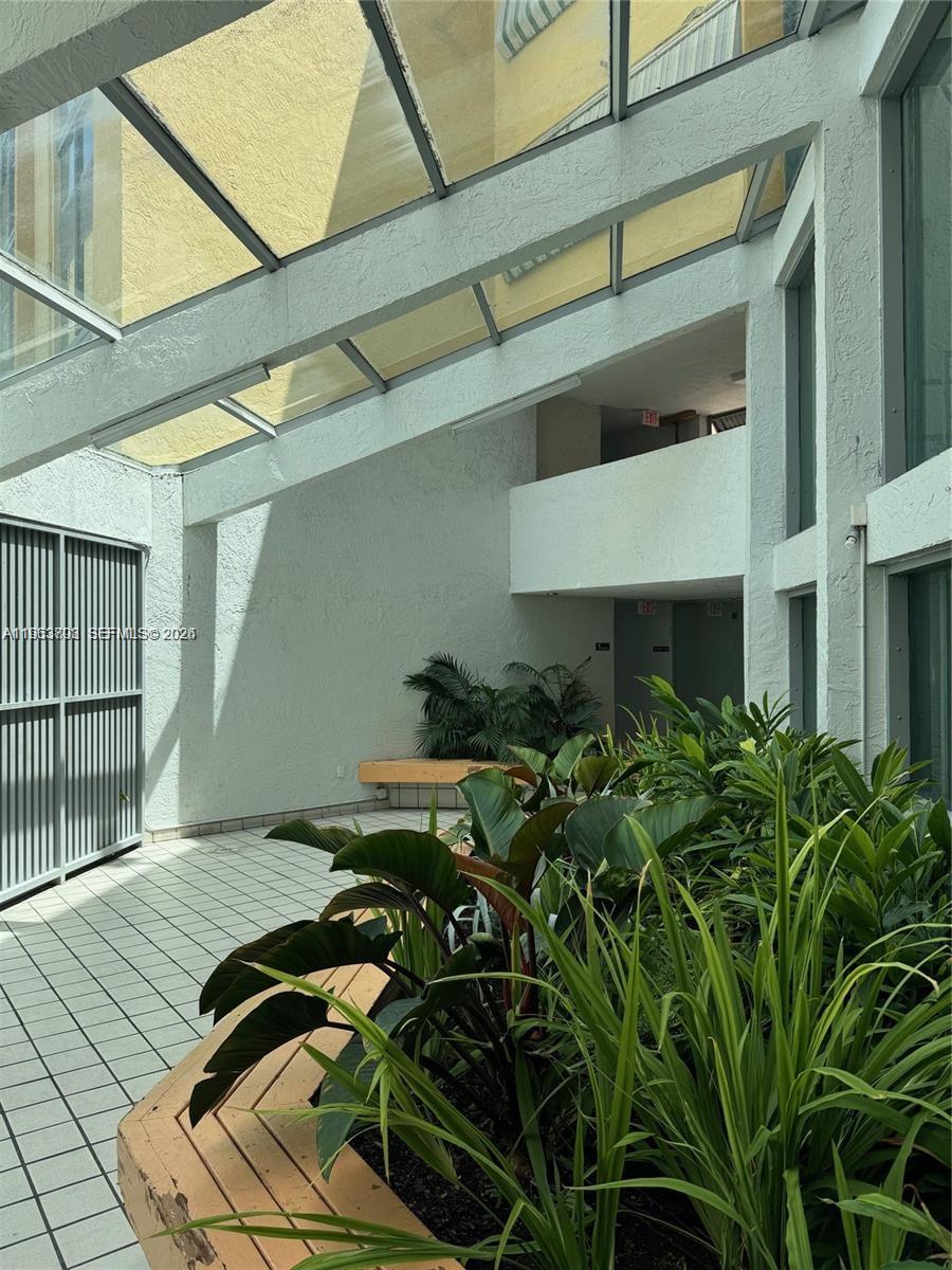 11790 Southwest 18th Street, Unit 3043 Miami, FL 33175 - Photo 4 of 12 a backyard of a house with lots of green space