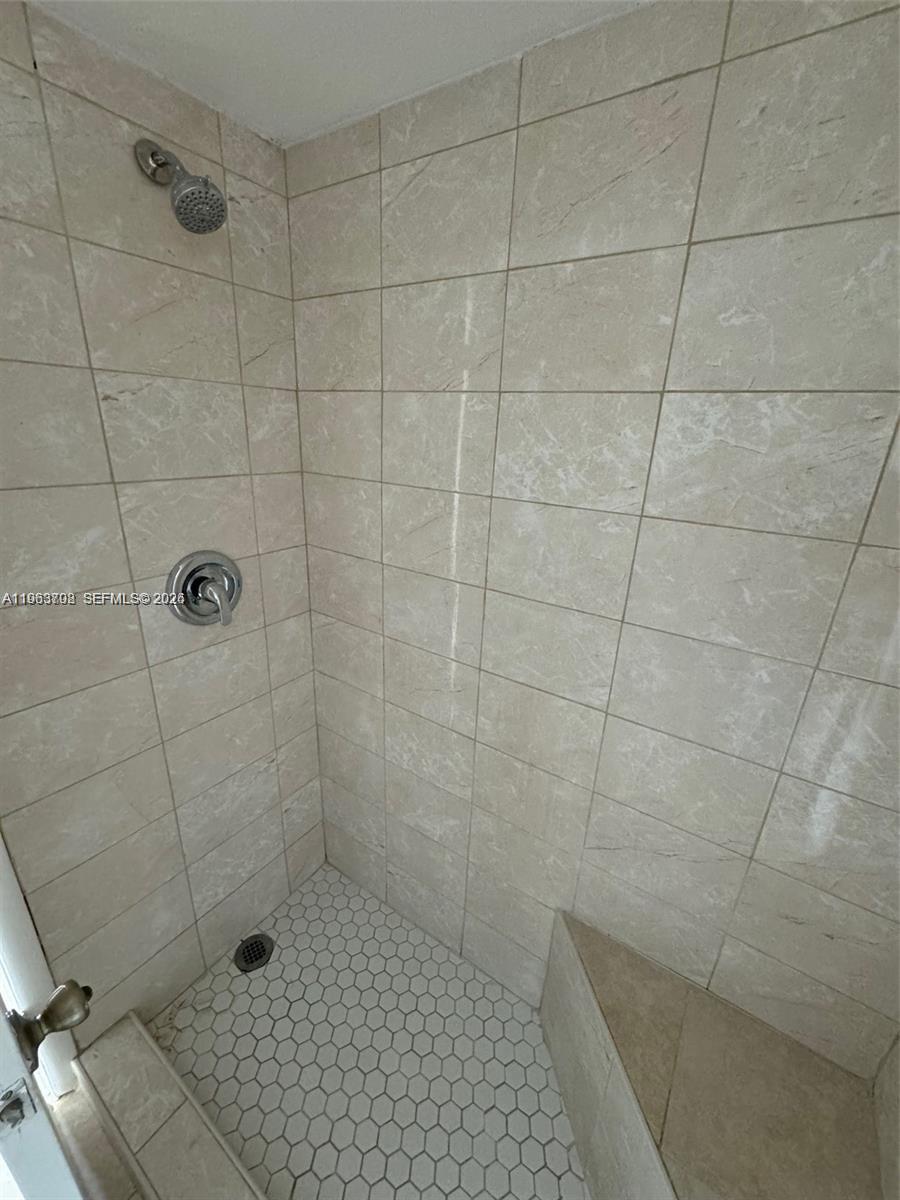 11790 Southwest 18th Street, Unit 3043 Miami, FL 33175 - Photo 5 of 12 a bathroom with a shower