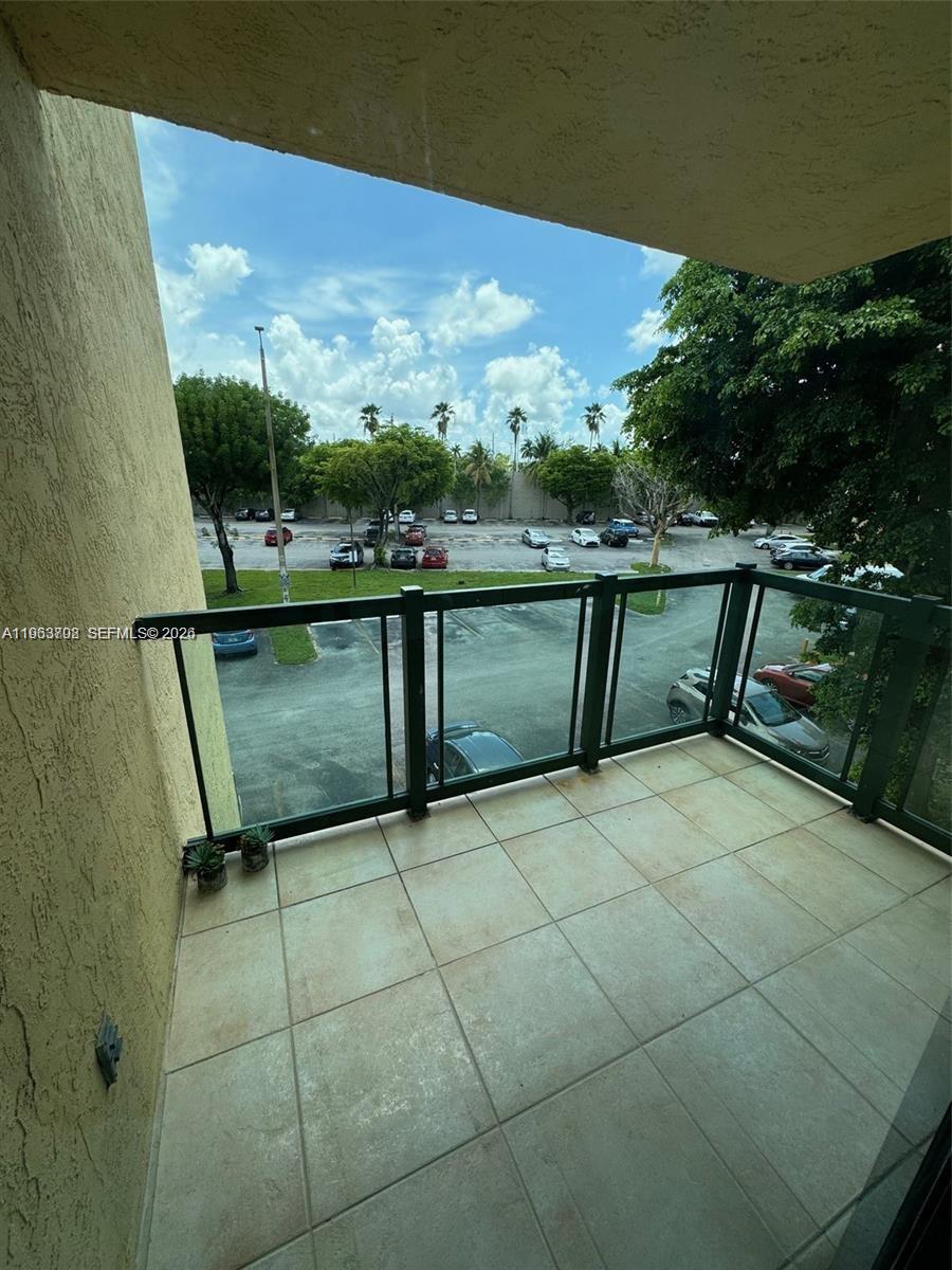 11790 Southwest 18th Street, Unit 3043 Miami, FL 33175 - Photo 8 of 12 a view of a terrace with sitting area