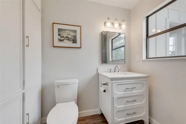 a spacious bedroom with a bed and a window