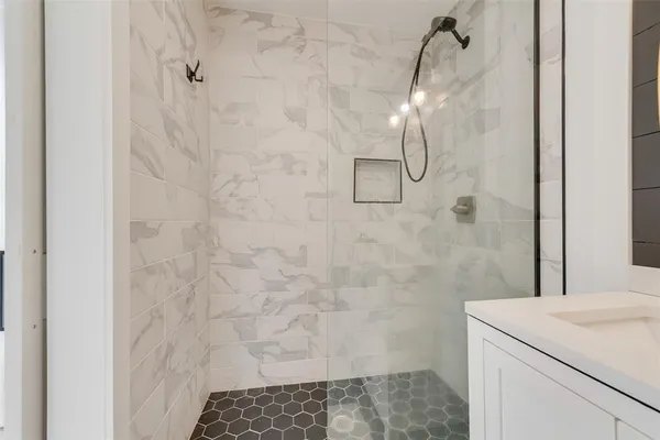 a bathroom with a toilet sink and shower