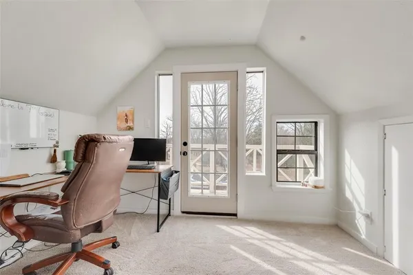 a bedroom with a large bed and ceiling fan