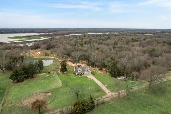 an aerial view of a houses with outdoor space