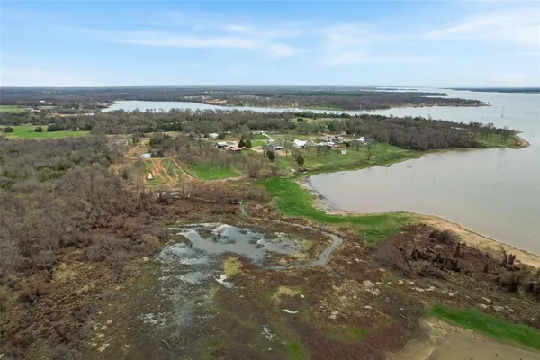 a view of a city street next to a yard
