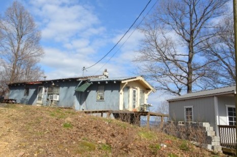815 Solomon Road Pulaski, TN 38478 - Photo 4 of 41 a front view of a house with garden