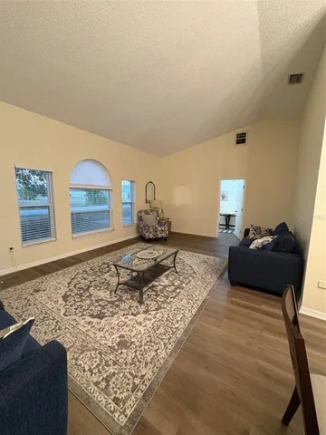 a room with furniture and wooden floor