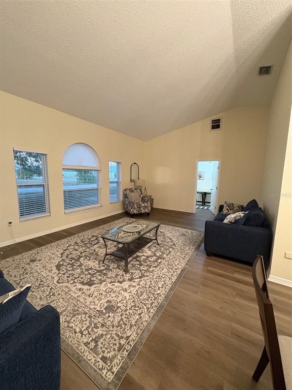 12123 Genoa Street North Port, FL 34287 - Photo 13 of 33 a living room with couch and rug