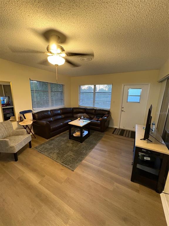 12123 Genoa Street North Port, FL 34287 - Photo 21 of 33 a bed room with a bed furniture and a flat screen tv