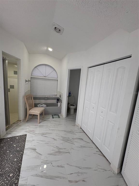 12123 Genoa Street North Port, FL 34287 - Photo 24 of 33 a living room with furniture and a rug