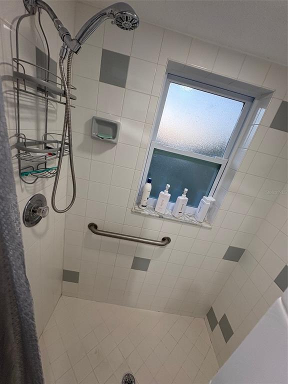 12123 Genoa Street North Port, FL 34287 - Photo 25 of 33 a bathroom with a shower