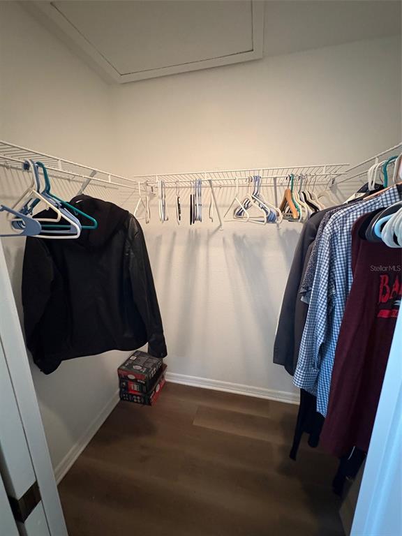 12123 Genoa Street North Port, FL 34287 - Photo 28 of 33 a view of walk in closet with clothes