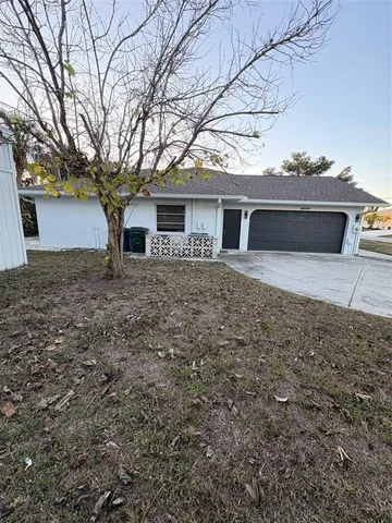 a view of a swimming pool with an outdoor space and seating area