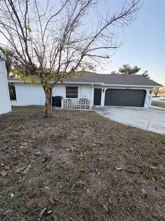 12123 Genoa Street North Port, FL 34287 - Photo 7 of 33 front view of house with a yard