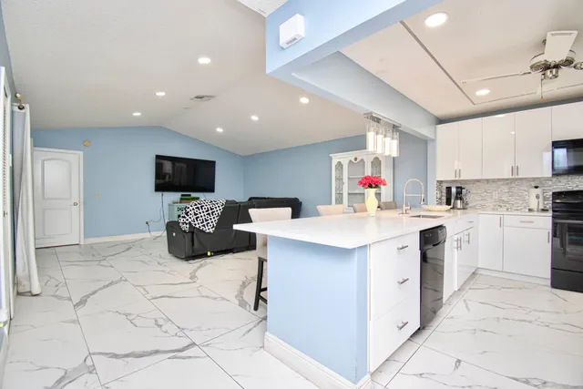 a view of a kitchen with microwave and a stove