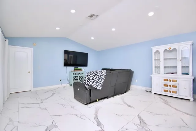 a living room with a couch and a flat screen tv